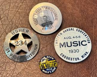 Vintage pins & buttons, including a 1933 ‘The World Champion Log Rollers’ World’s Fair pin and a vintage Board of Park Commissioners Air Port workers badge