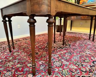 Beautiful antique mahogany wood dining set.  The table measures 42” wide x 62” deep, and extends to 98” with the three 12” leaves.  This table comes with a full set of table pads