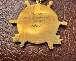 1950’s Minneapolis Aquatenial women’s 100yd Freestyle 1st Place medal and 1950’s girls swimming medal charm bracelet