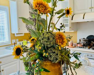 Beautiful faux botanical arrangement in an antique French confit pot