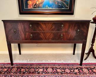 Antique sideboard with lion head pulls