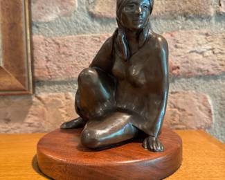 Small scale bronze sculpture of a Native American Woman by Lena Beth Frazier, numbered 41 out of 150