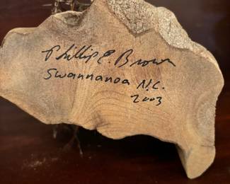 Signature on bottom of bird