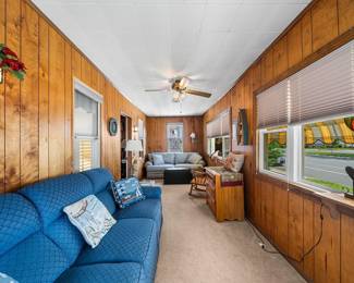 Enclosed porch with two couches