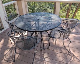 Lot #70 - Black Metal Table Patio Table & Four Chairs With Cushions
