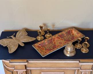 Lot #52 - Vintage Home Decor Lot - Butterfly Trivet, Brass Candle Holders and Bell, and Decorative Tray