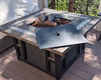 Lot #75 - Outdoor Fire Pit Table with Decorative Logs and Propane Tank Storage
