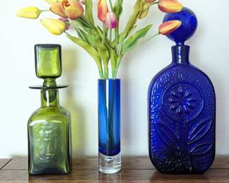 Lot #115 - Mid Century Blenko Wayne Husted Decanter, Green Glass Decanter, & Blue Glass Vase With Faux Tulips