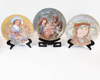Lot #29 - Edna Hibel Collector Plates: "Lily," "1987 Christmas Plate," "Wendy"