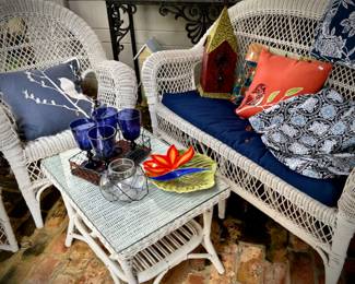 White wicker settee, chair, and coffee table
