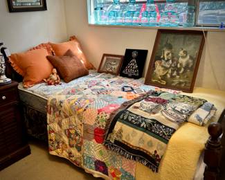 Twin bed with vintage quilts