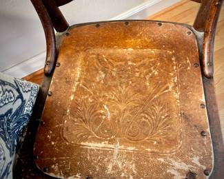 Antique chair with embossed leather seat
