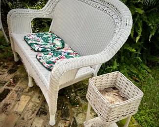 White wicker settee and plant holder
