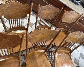 A set of six wooden chairs.