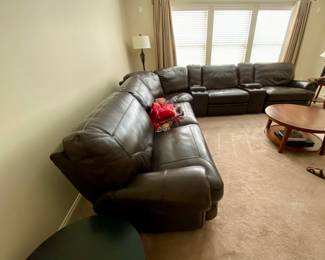 Brown Leather Sectional Sofa. High end.  Has 10’ arm to arm sofa w two electric recliners on each end. Also with two cup holder pieces that are 12” wide and one corner piece plus one additional reclining piece