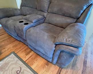 Grey reclining couch available for pre purchase 