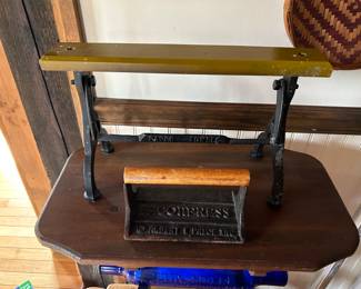 BACON PRESS AND A PAPER TOWEL HOLDER.