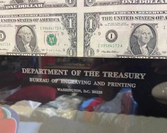 Uncut sheet of $1 bills.