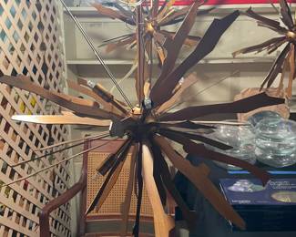 Jagged Starburst Antique Gold six-light chandeliers (3). 