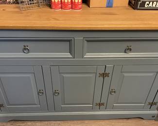Blue cabinet with countertop.
