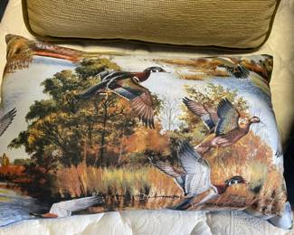 Fabric pillow with ducks.