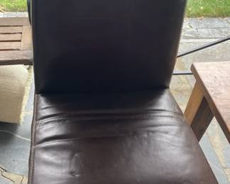 Brown leather dining chair.

