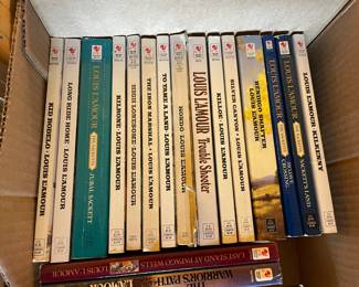 Collection of Louise L'Amour books.