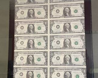 Uncut sheet of $1 bills.