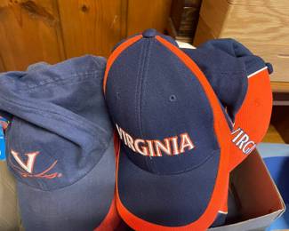 Nice selection of baseball caps - schools and sports teams.