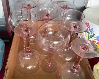 Set of nine pink wine glasses.