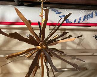 Jagged Starburst Antique Gold six-light chandeliers (3). 