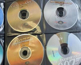 Folder with over 50 CDs.