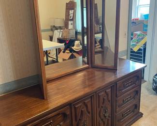 Four-piece bedroom set - bedroom with mirror, armoire and two night stands.