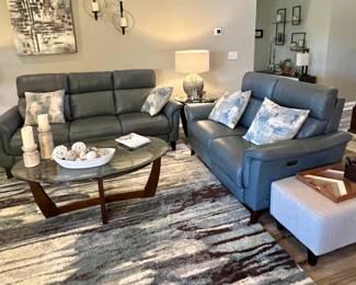 Living room set featuring Cindy Crawford Home reclining sofa and loveseat