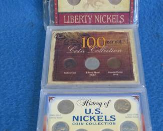 Lot 112. Three slabbed coin sets