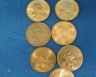 Lot 72. 8 gold-colored Sacagawea dollars and one gold-colored 2011 Andrew Johnson dollar