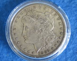 Lot 59. 1897 O Morgan Silver Dollar