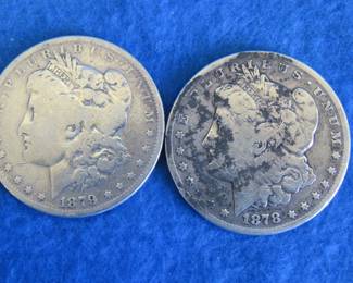 Lot 28. 1878 S and 1879 P Morgan Silver Dollars