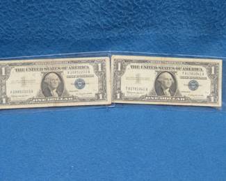 Lot 79. Two 1957 B $1.00 silver certificates