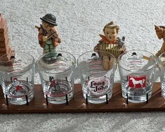 WST059 (6) Large Sized Whiskey Glasses and (6) "Goebel" Figures Made In West Germany By M.J. Hummel.
