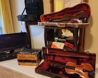 Violin #1 (lighter colored brown). ¾ size. Kagan and Gaines , made in Germany. early 60's. No cracks, needs minor repair.