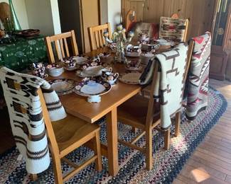 Arts & Crafts style dining table with 6 chairs, one of two rag rugs