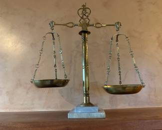 Antique brass scale on marble base