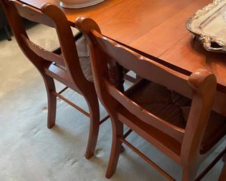 Gate-leg table w 4 leaves and pads and 6 chairs 