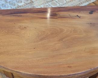 Close-up of mahogany gateleg table, from the home of the former owners of Casey's Department Store at Duke of Gloucester Street