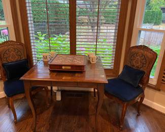 Mahogany game table with 4 drawers and 2 mahogany side chairs with blue velvet seats and lumbar pillows