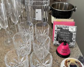 Ridell champagne flutes, Marquis Waterford glasses, ice bucket, napkins, coasters and bar "bell"