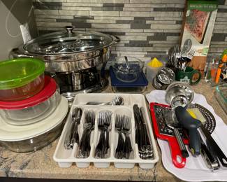 covered chaffing dish, glass covered dishes, flatware, and kitchen utensils