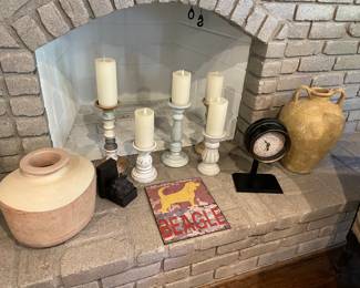 Large urns shown with pillar candle holders and flameless candles (sold as a set); vintage reproduction clock, bookend, and beagle artwork on metal