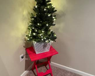 folding table and small faux tree for planter